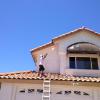 Pressure washing a two story house